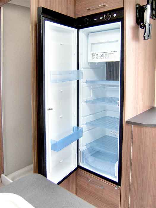 Interior view of the large fridge with freezer top box.